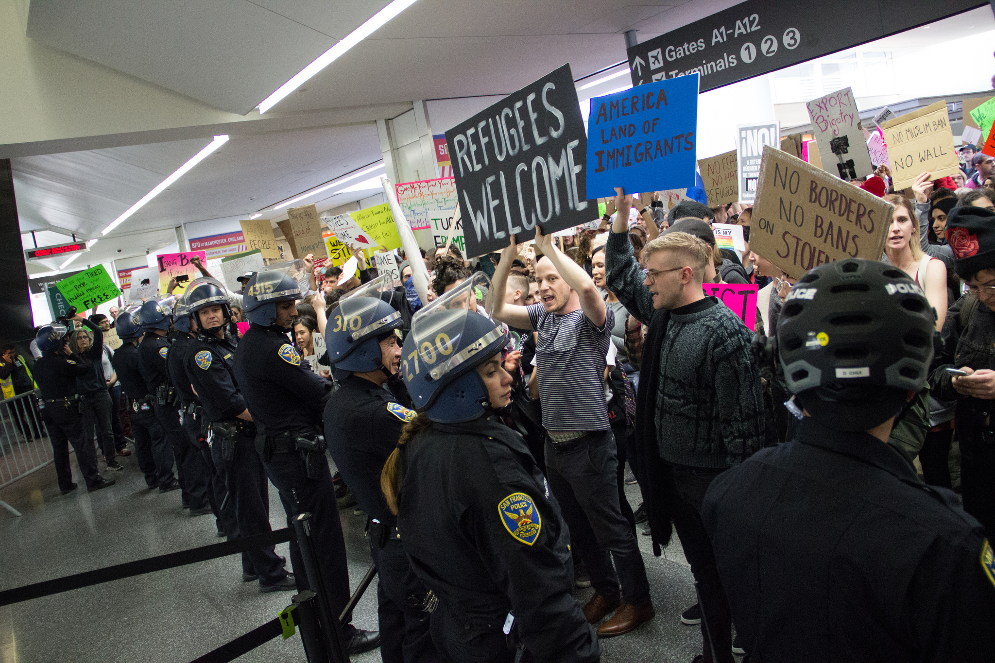 A protest of the travel ban at San Francisco International Airport, Jan. 29, 2017. Source: Peg Hunter, via Flickr [CC BY-NC 2.0]